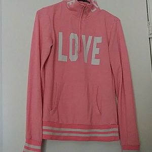 Pink pullover with love in white letters